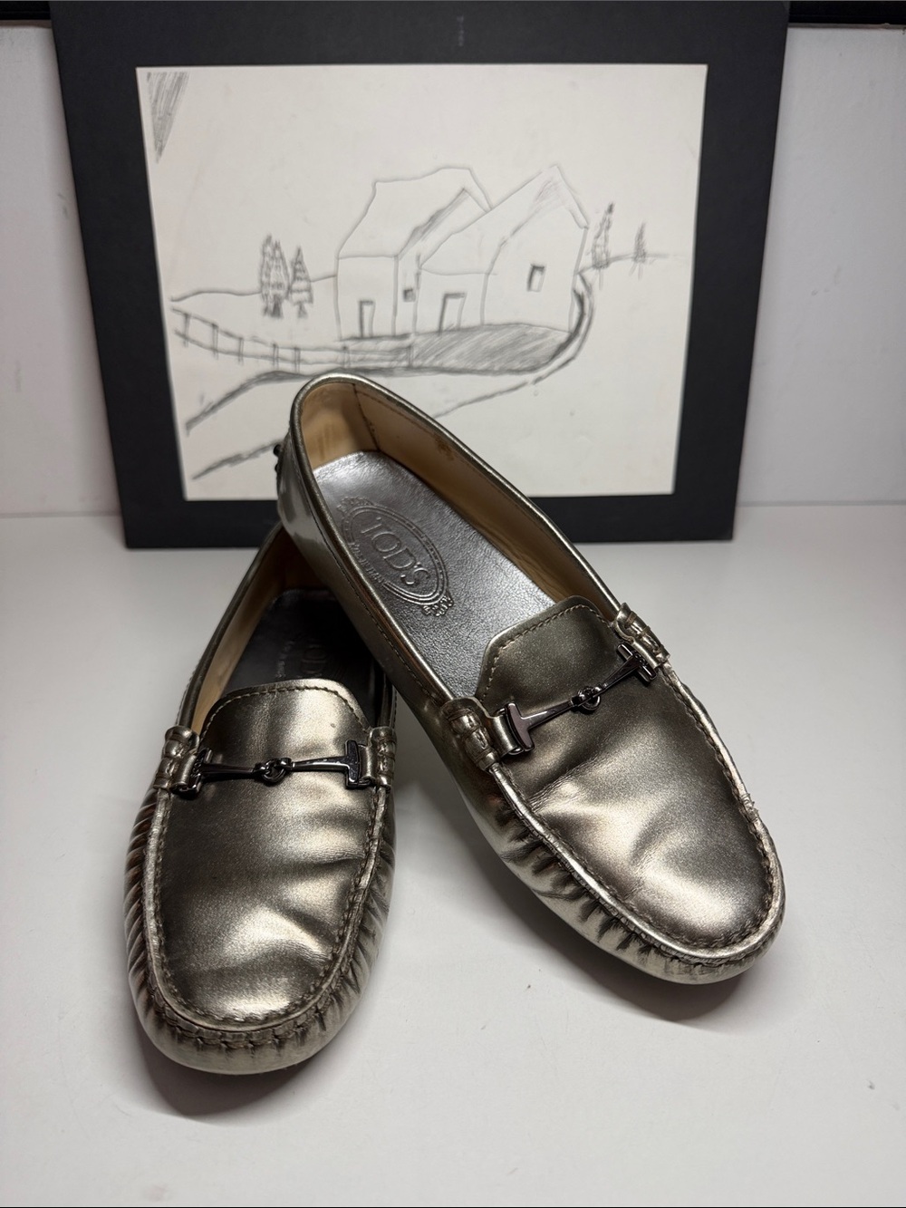 Tod’s Patent Leather Silver Metallic  Mocassind . Women's Size US 6
